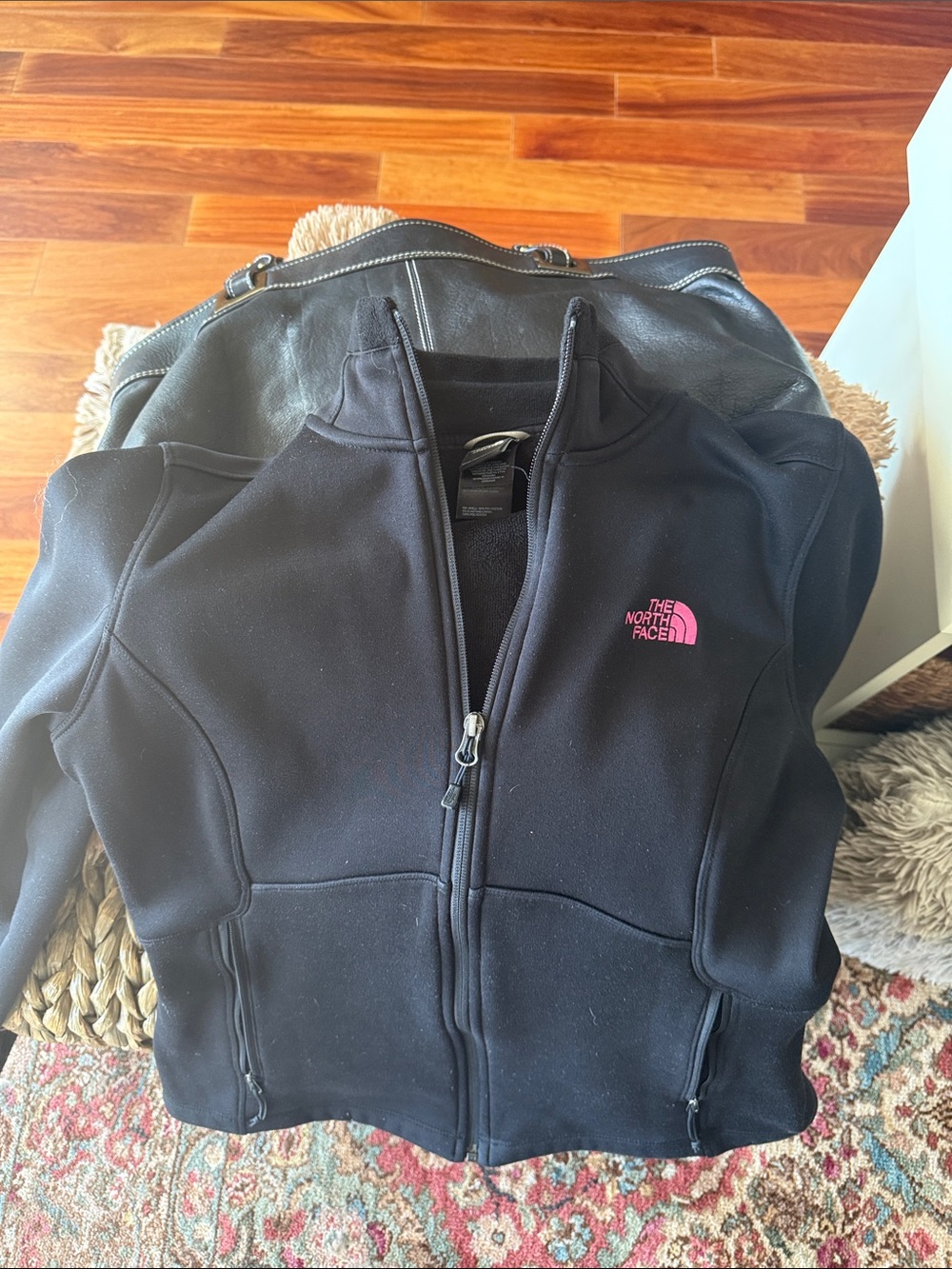 The North Face Black Jacket with Pink Logo Accent
